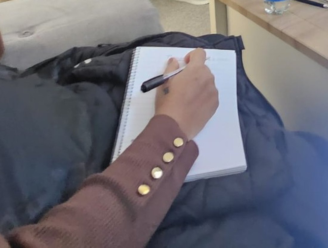 A member of the Bellsway team taking notes during an in-house training session